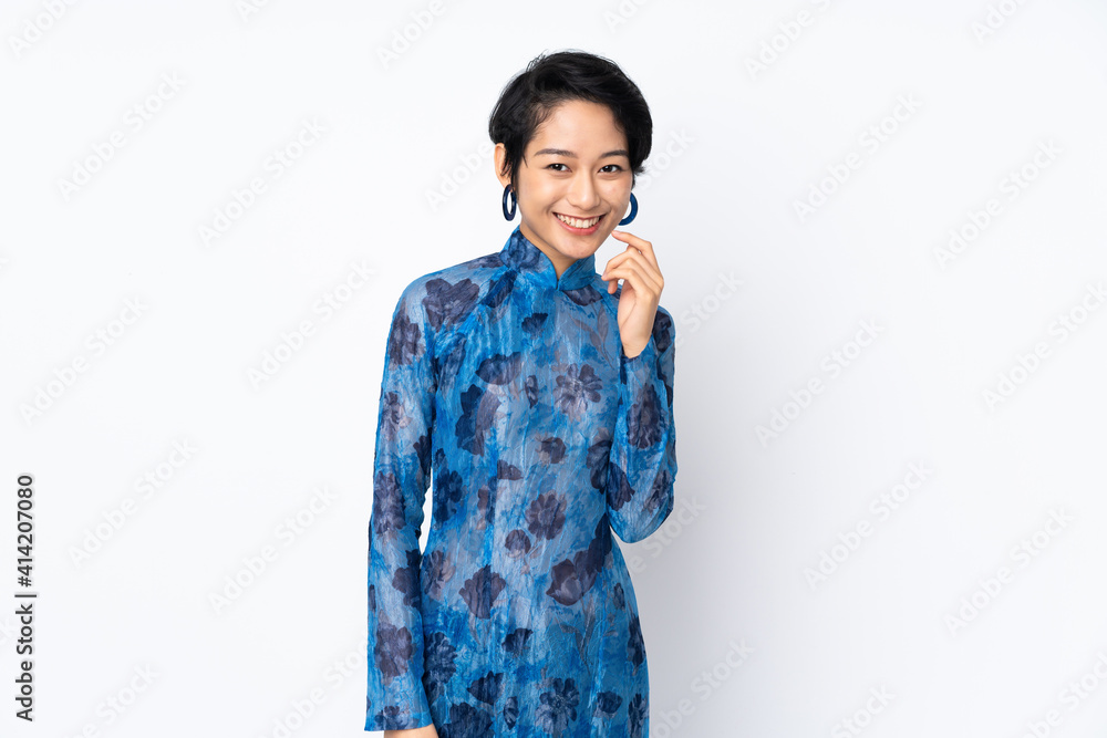 Young Vietnamese woman with short hair wearing a traditional dress over isolated white background laughing Young Vietnamese woman with short hair wearing a traditional dress over isolated white background laughing