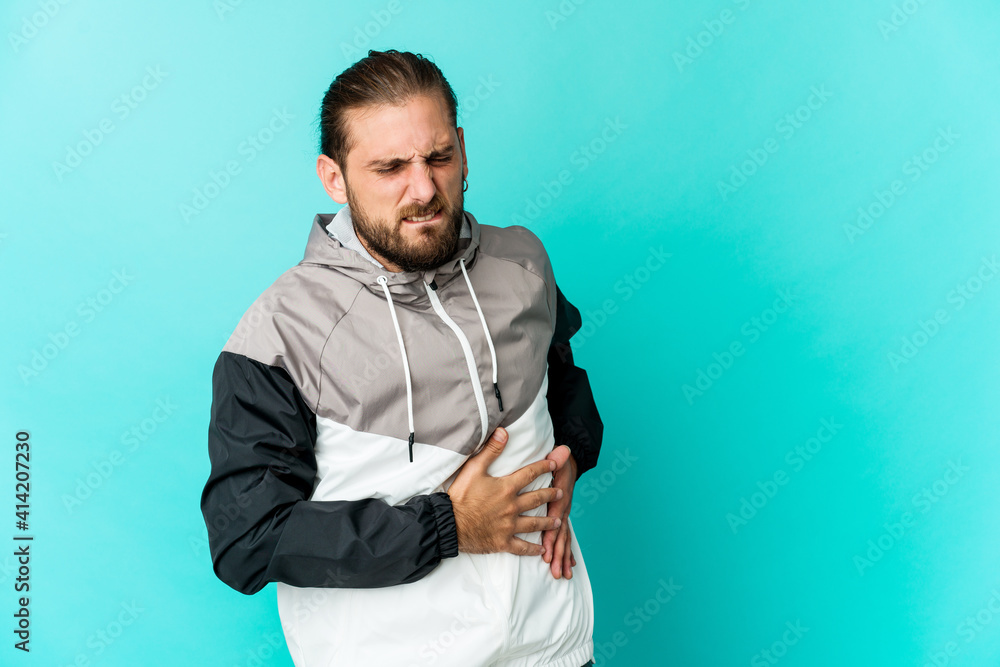 Young man with long hair look having a liver pain, stomach ache. Young man with long hair look having a liver pain, stomach ache.