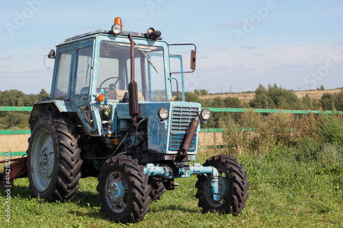 Blue tractor in the field.