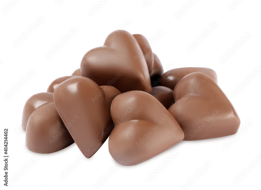 Fototapeta premium Beautiful heart shaped chocolate candies on white background