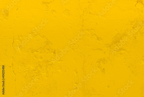 cement wall surface with yellow paint for blank and copy space text