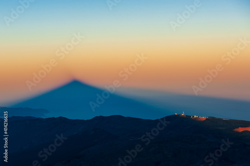 Silhouette of shadow of volcano del Teide at sunset. Pico del Teide mountain in El Teide National park. Tenerife, Canary Islands, Spain