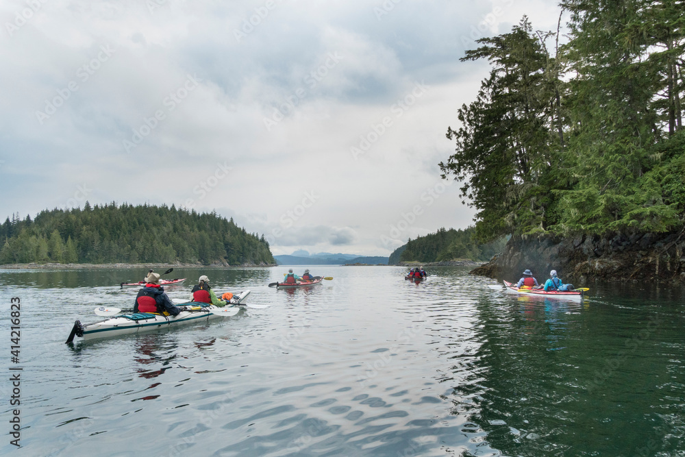 Canada, British Columbia. Sea kayakers paddle in the Broughton Archipelago near Blackfish Sound.