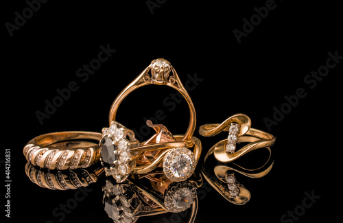 Canvas Print A golden scrap of old gold jewelry on black background