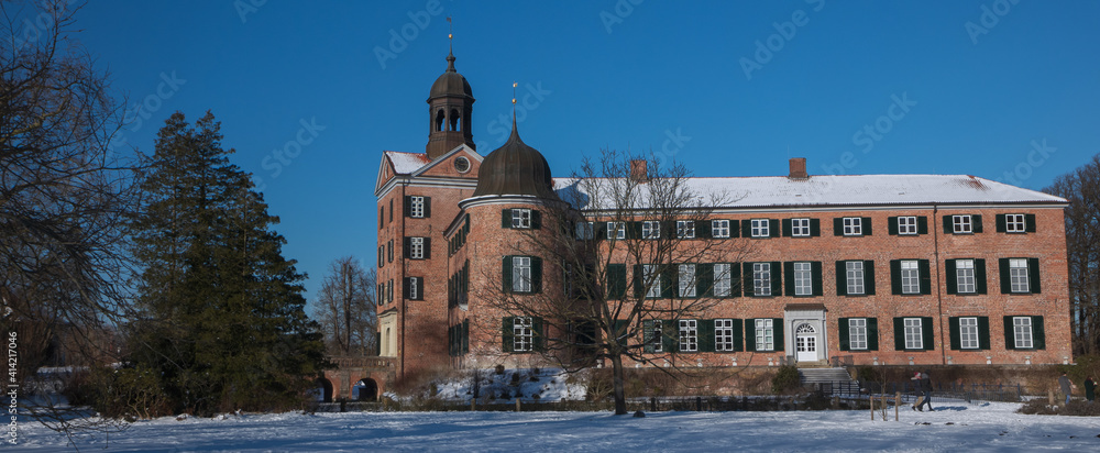 Panoramic view to Eutin castle in winter landscape.
