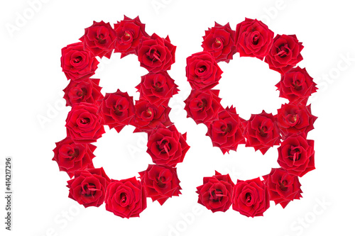 Numeral 89 made of red roses on a white isolated background. Element for decoration. eighty nine. Red roses. photo