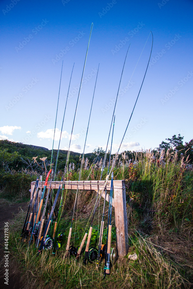 Fototapeta premium Group of fly-fishing rods stacked in a rod holder at a camp in Alaska.