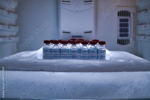 Photography pool of covid 19 vaccines in a block of ice for preservation and transport