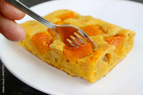 Closeup Fork Cutting a Slice of Tasty and Healthy Butternut Squash Cake Bar