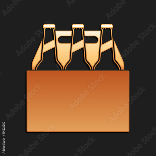 Gold Pack of beer bottles icon isolated on black background. Case crate beer box sign. Long shadow style. Vector.