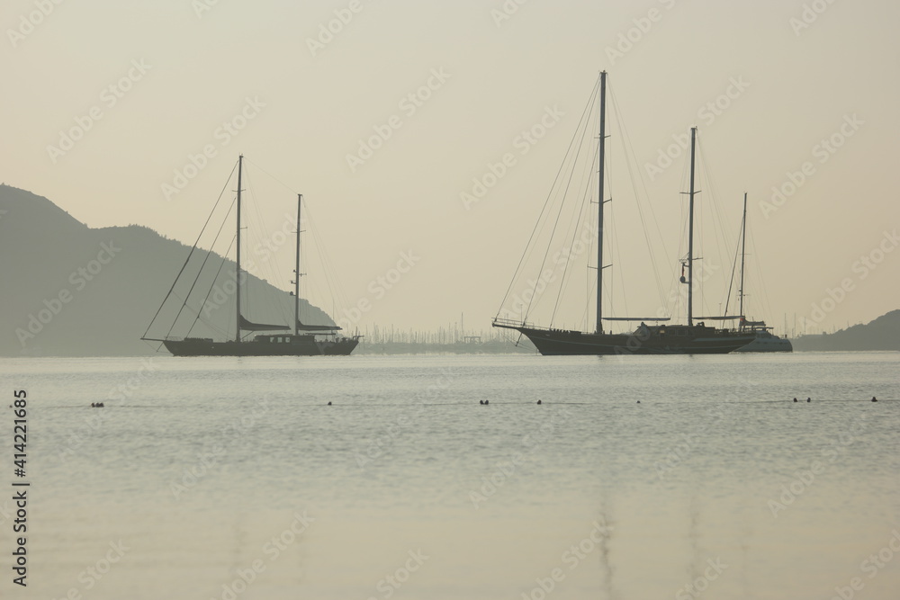 Fototapeta premium Landscape panorama with sea, yachts and mountains. Sea voyage concept.