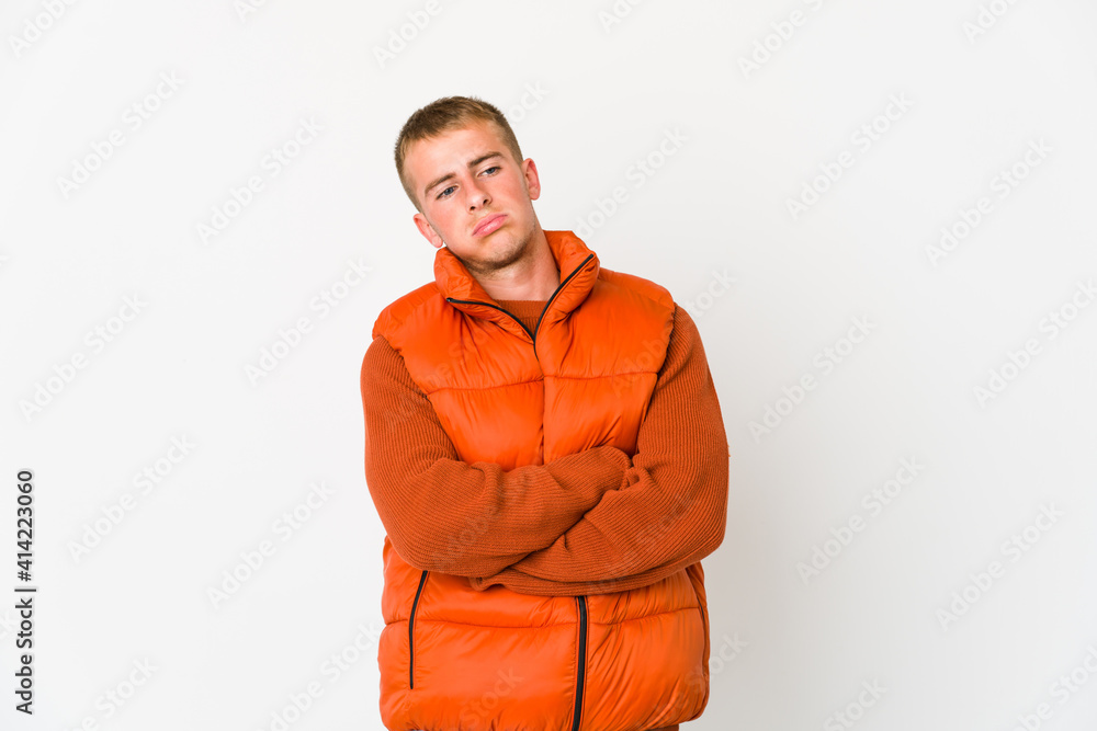 Young caucasian handsome man tired of a repetitive task.