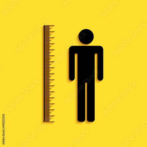 Black Measuring height body icon isolated on yellow background. Long shadow style. Vector.
