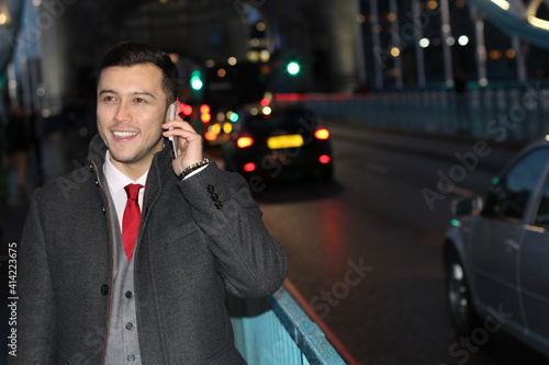 Wallpaper Mural Ethnic businessman walking the city street at night Torontodigital.ca