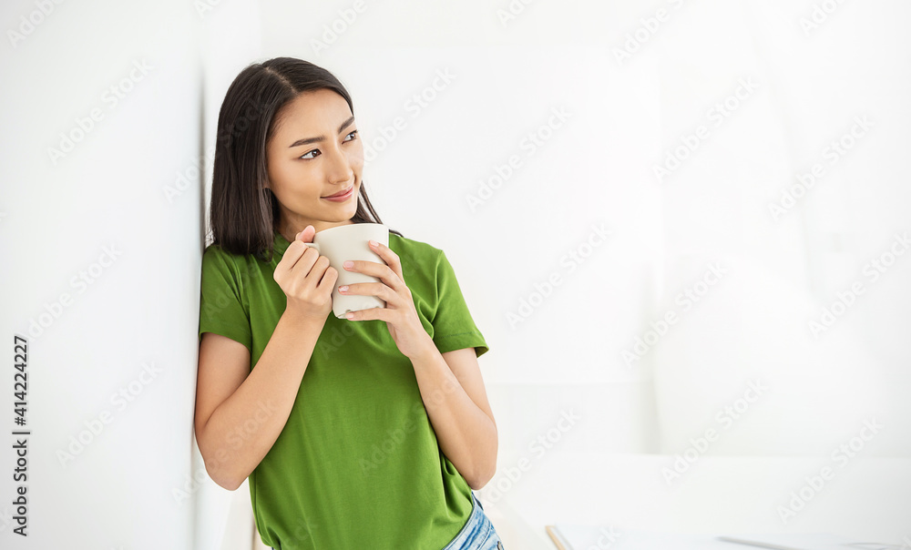 Portrait of young beautiful asian woman hands holding coffee cup morning spring time in white room. Happy cheerful relaxing in summer. Korean makeup wakeup university asia lifestyle barista concept. Portrait of young beautiful asian woman hands holding coffee cup morning spring time in white room. Happy cheerful relaxing in summer. Korean makeup wakeup university asia lifestyle barista concept.