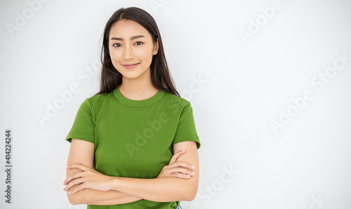 Attractive beautiful positive asian woman - close up portrait asian nerdy girl. Portrait of pretty nerd Japanese asia lady wearing green t shirt with smile isolated on white background.