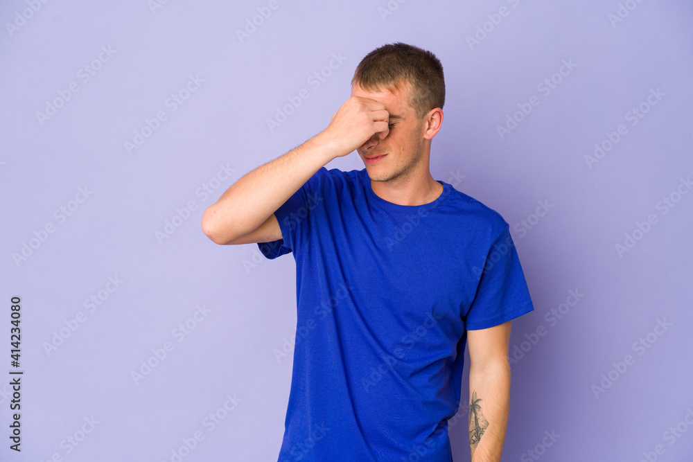 Young caucasian handsome man having a head ache, touching front of the face. Young caucasian handsome man having a head ache, touching front of the face.