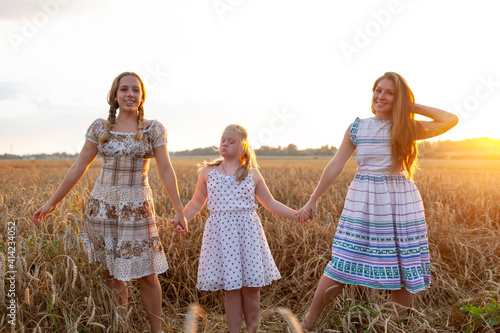 Portrait of beautiful young girls outside, down syndrom
