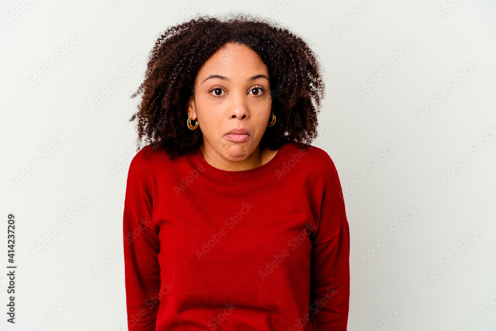 Young african american mixed race woman isolated shrugs shoulders and open eyes confused. Young african american mixed race woman isolated shrugs shoulders and open eyes confused.