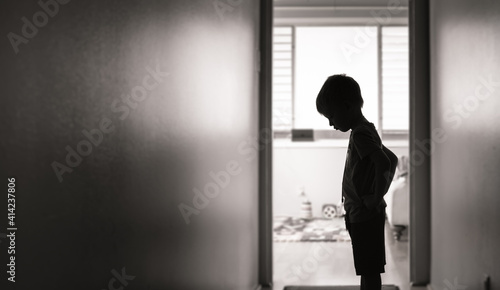 little boy at home feeling sad  photo