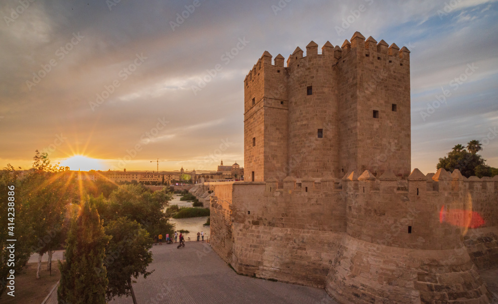 Roman Bridge and Tower in Cordoba with a Sunset