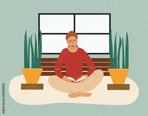 Attractive girl reading book in turkish pose at home