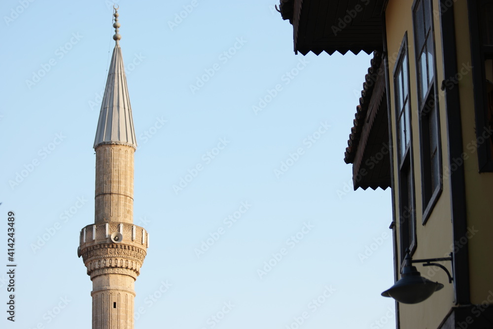 Minaret on a background of blue sky. Islamic faith concept.