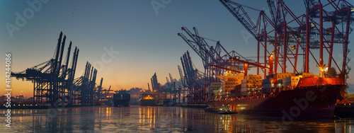 Container terminal in the port of Hamburg in the morning in freezing temperatures 