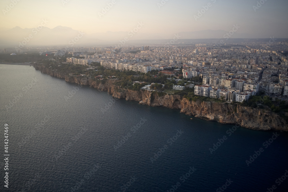 Panorama of resort town on Mediterranean coast. Panoramic aerial view of seaside resort. Antalya, Turkey.