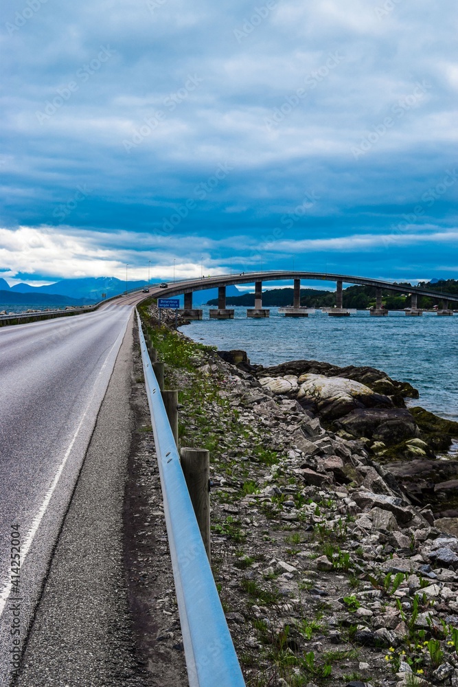 Road 64 to Bolsoy Bridge or Bolsoybrua that crosses the Bolsoysund strait between mainland and island of Bolsoya. Norway. Road 64 to Bolsoy Bridge or Bolsoybrua that crosses the Bolsoysund strait between mainland and island of Bolsoya. Norway.