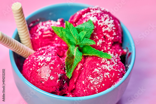 Wallpaper Mural Raspberry ice cream in blue bowl on stone table, decorated with several leaves of mint and with waffle sticks. Torontodigital.ca