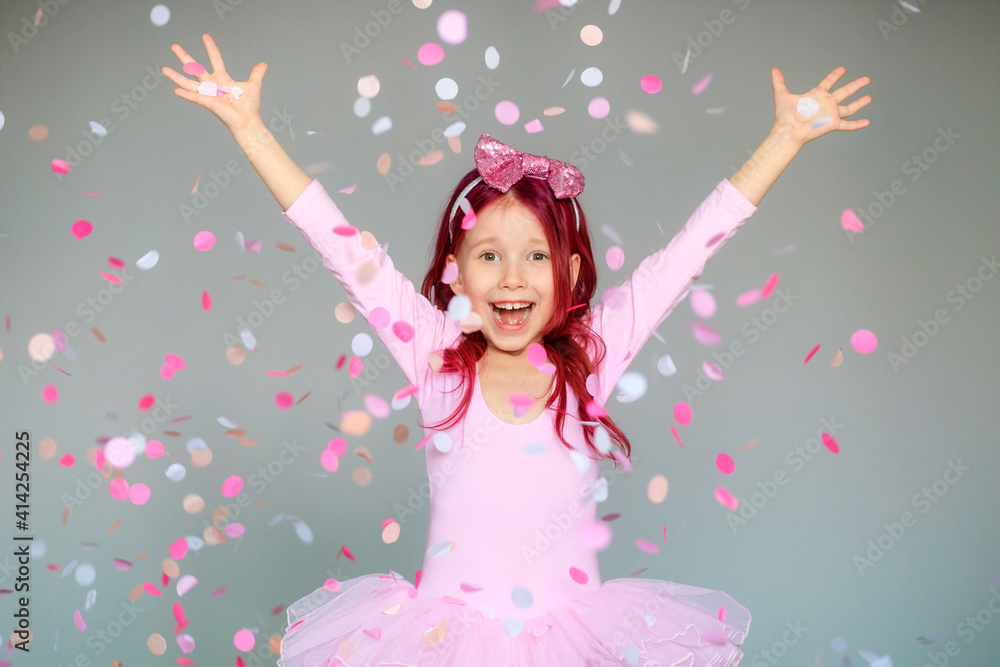happy birthday girl with confetti on gray background Stock Photo