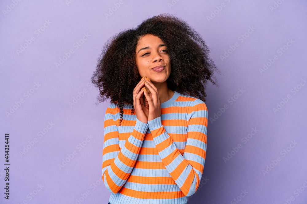 Young african american curly woman isolated on purple background making up plan in mind, setting up an idea.