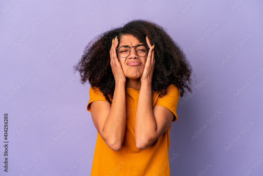 Young african american curly woman isolated on purple background whining and crying disconsolately. Young african american curly woman isolated on purple background whining and crying disconsolately.