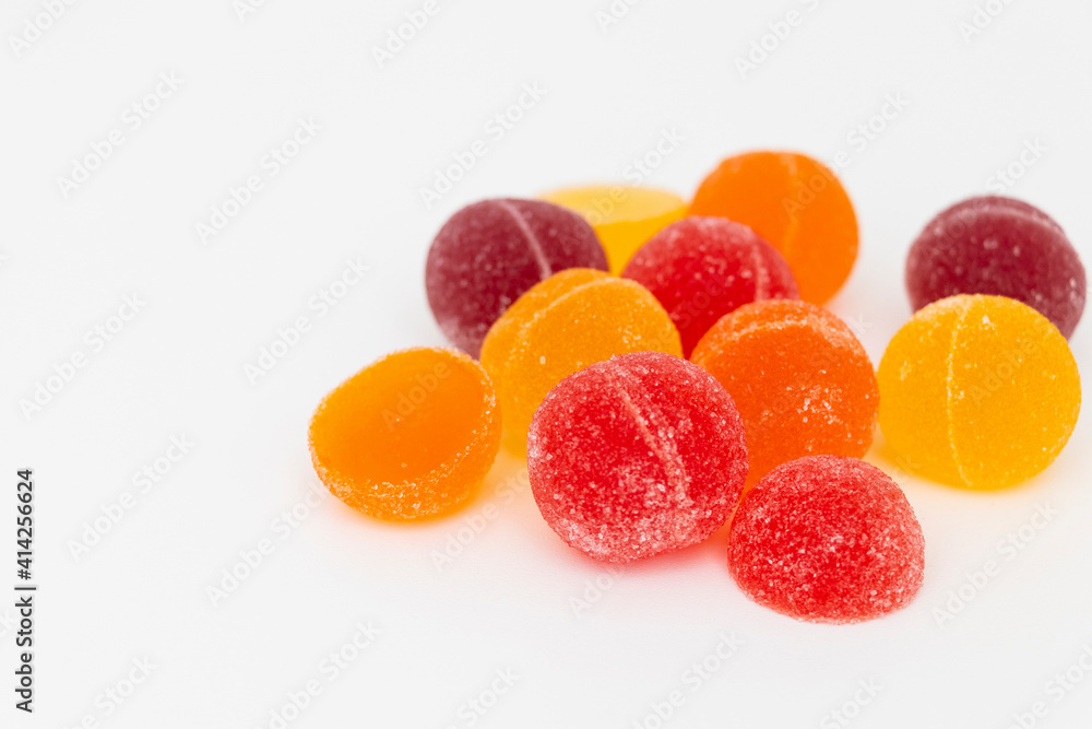 Colorful fruit marmalade on a white background, close-up, top view. Colorful fruit marmalade on a white background, close-up, top view.