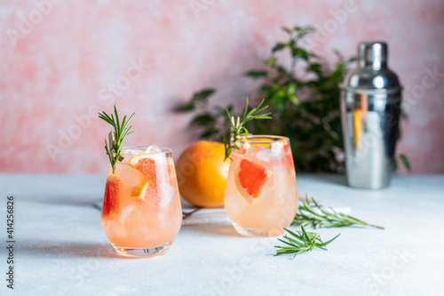 фотографія Tequila cocktail or cold lemonade with grapefruit juice, tinted with the aroma o