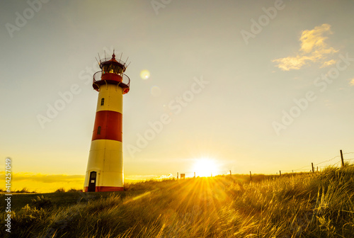 Photos Sunset at the lighthouse List East on a dune of the island Sylt, North Sea, Germ