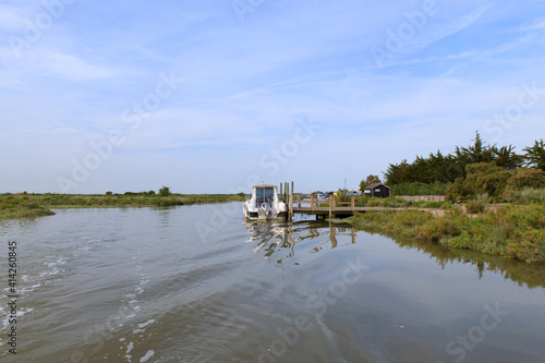 Landscape with boat and dock photo