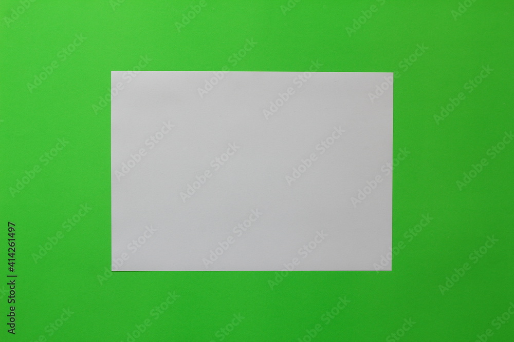mock-ups paper on green background, white paper Blank portrait A4. brochure magazine. use banners products business cards to showcase your mock-ups paper on green background, white paper Blank portrait A4. brochure magazine. use banners products business cards to showcase your
