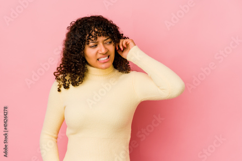 Young african american afro woman isolated covering ears with hands.