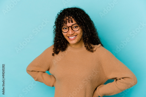 Young african american afro woman isolated happy, smiling and cheerful. © Asier