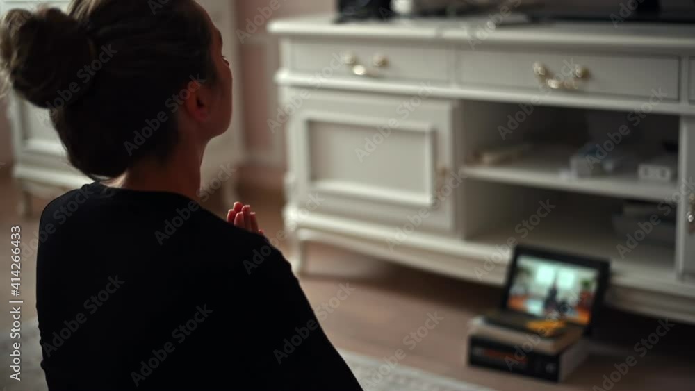 Woman wearing black sport suite practicing yoga at home, fitness exercising Woman wearing black sport suite practicing yoga at home, fitness exercising
