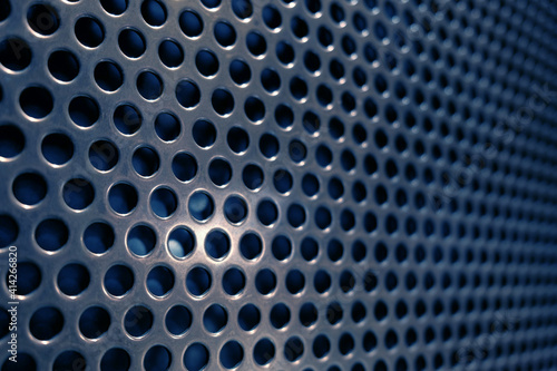 blue metal lattice with holes as an abstract background
