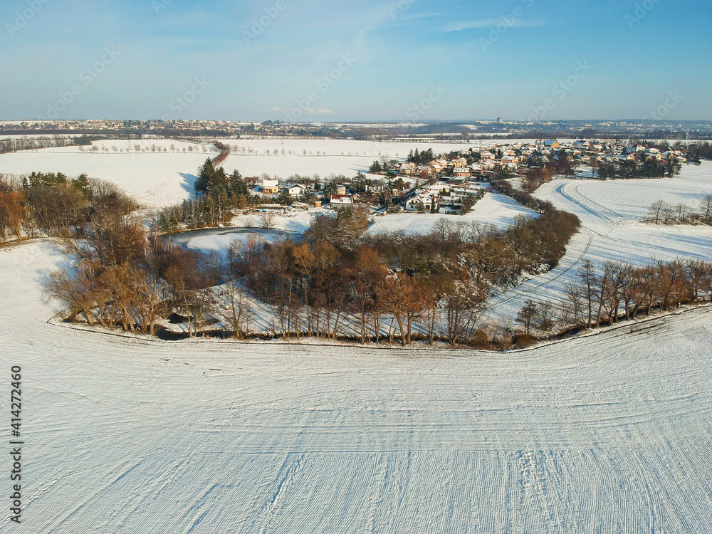 Lipany, Czech republic - January 11, 2021. Aerial view of village in winter under snow