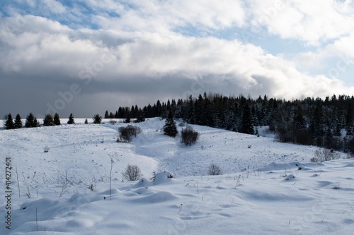 Winter in the mountains. Panorama, sky, clouds. 