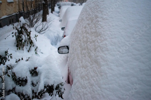 Winter, lots of snow. Cars are covered with snow. Street. Shtorm photo