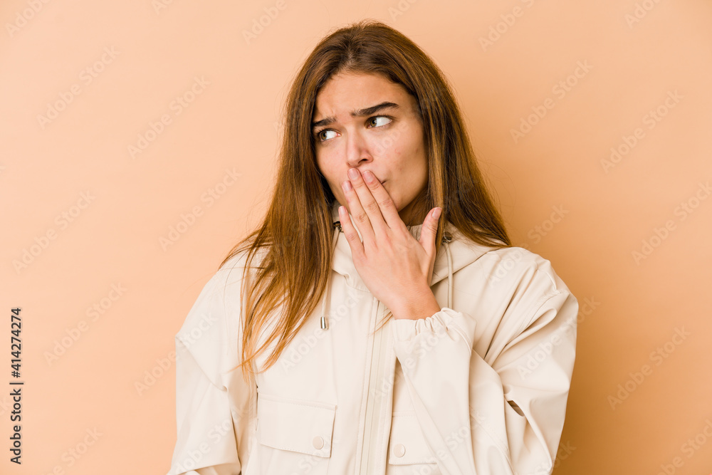 Young skinny caucasian teenager girl yawning showing a tired gesture covering mouth with hand. Young skinny caucasian teenager girl yawning showing a tired gesture covering mouth with hand.