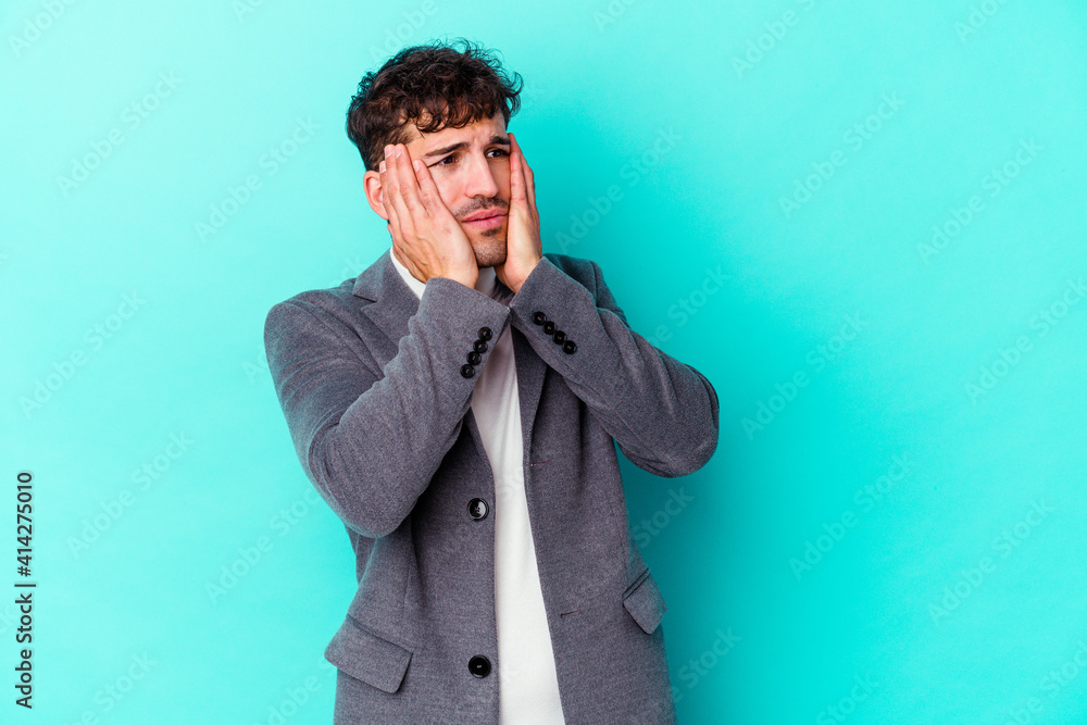 Young caucasian man isolated on blue background whining and crying disconsolately. Young caucasian man isolated on blue background whining and crying disconsolately.