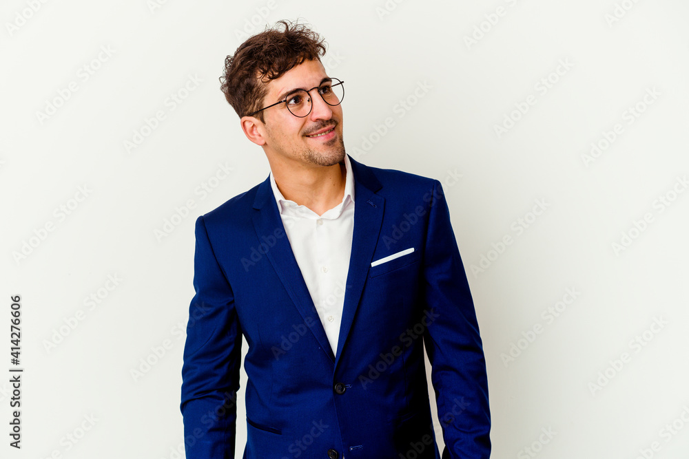 Young business caucasian man isolated on white background relaxed and happy laughing, neck stretched showing teeth. - obrazy, fototapety, plakaty 