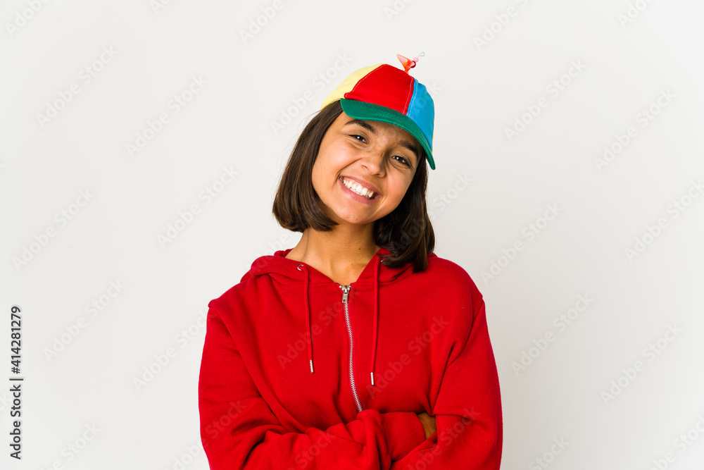 Young hispanic woman wearing a cap with propeller isolated happy, smiling and cheerful. Young hispanic woman wearing a cap with propeller isolated happy, smiling and cheerful.